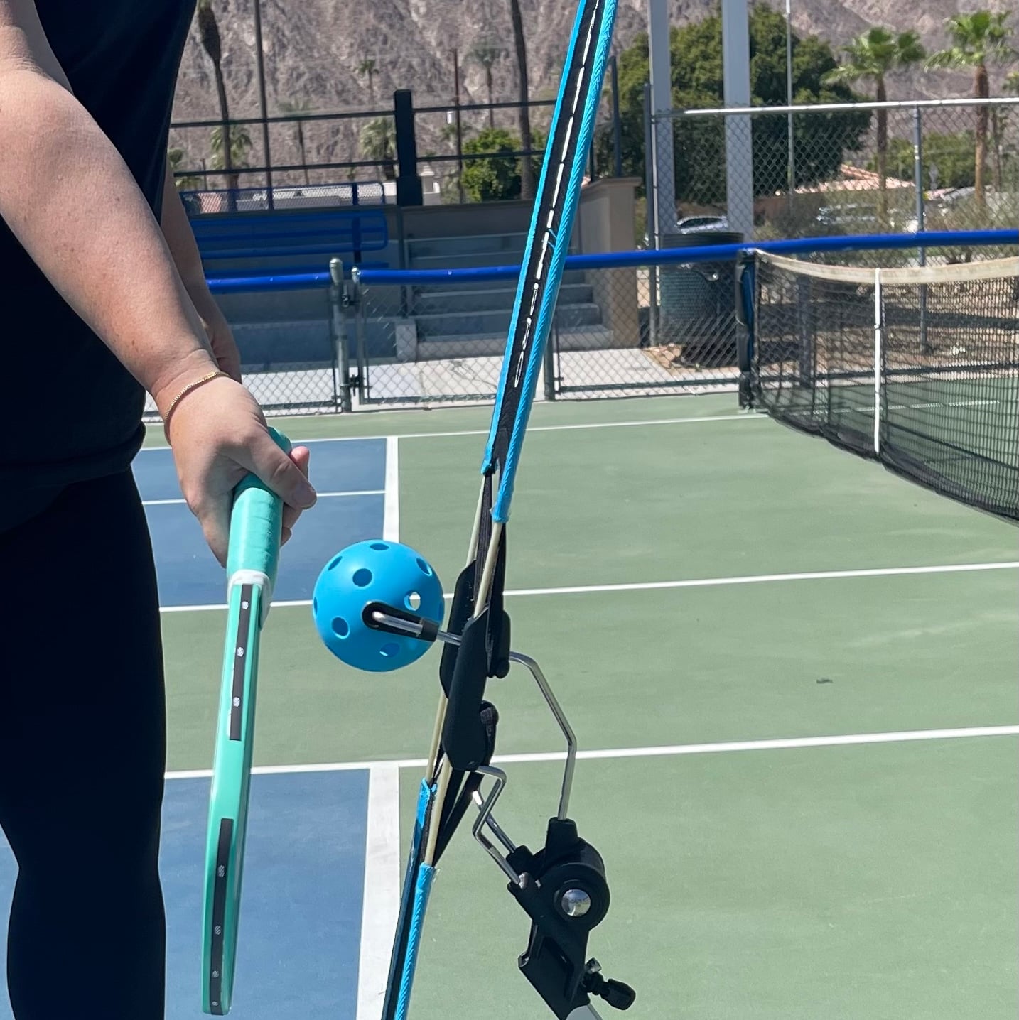 Player grooving the windshield-wiper swing on the TopspinPro