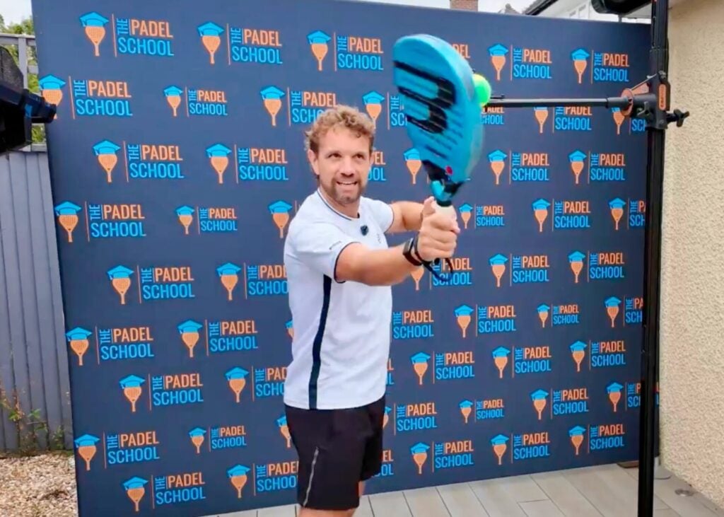 Sandy Farquharson practising a padel overhead on the SpinPro